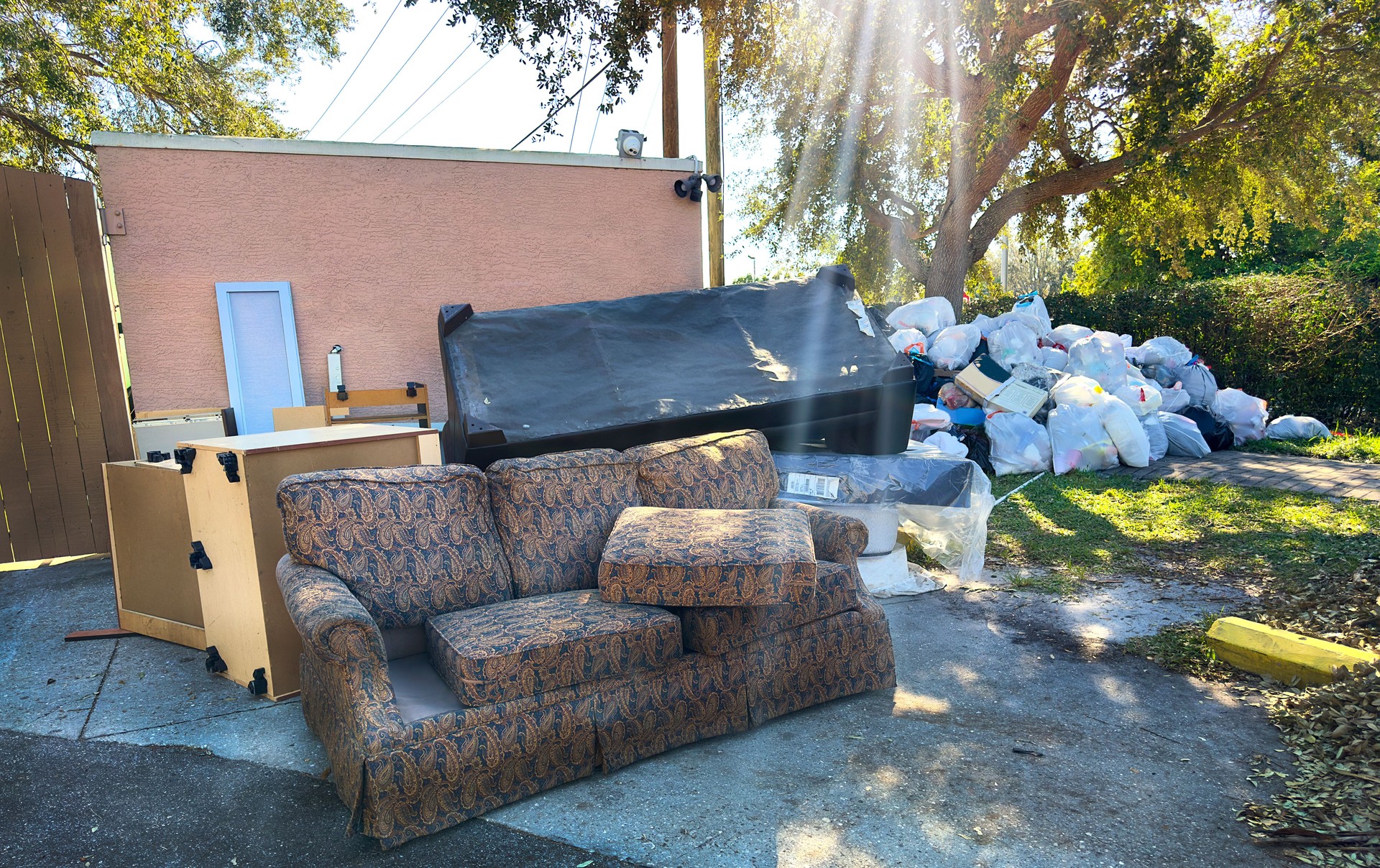 Furnitures and garbage bags at garbage dump area